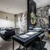 Rivertain Hotel Daegu room with black leather bed, marble-style walls, and modern bath vanity