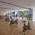 Novotel Living Saigon South gym in Ho Chi Minh City with cardio machines and large windows