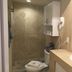 Studio Suite at Marina Cabo Plaza bathroom with glass shower, vanity sink, and wall-mounted cabinet in Cabo San Lucas