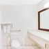 Baymont by Wyndham Midland Airport accessible bathroom in Midland with shower, toilet, and grab bars