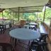 Kinabalu Poring Vacation Lodge in Kundasang open-air dining area with tables and forest views
