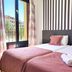 Flats Friends Plaza de la Reina Valencia twin bedroom with balcony doors and city view