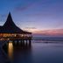 Anantara Veli Maldives Resort overwater restaurant at sunset in Veligandu Huraa