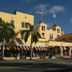 Colony Hotel & Cabana Club in Delray Beach, yellow historic hotel with striped awnings and palm trees