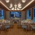 JW Marriott Hotel Hong Kong dining room with round tables, city views and ceiling lights in Hong Kong