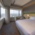The Blossom Kumamoto guest room with king bed and city views in Kumamoto