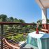 Apartments with Pool Villa Rossella 1 in Rovinj, balcony with table, chairs and green view