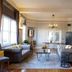 Princess Anne Hotel Asheville lobby with tufted sofas, chandelier, coffee table and hardwood floors