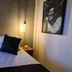 Apart Hotel Brisas do Amor, Pipa: cozy double bed with bedside lamps and wall art