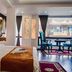 Hotel Jagjeet, Darjeeling guest room with bed, seating area, and mountain-view window