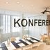 The Passage - Urban & Lifestyle Hotel Basel conference room with table, chairs, projector and large windows