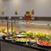 Extenso Hotel Izmir buffet display with fresh salads, fruit, and glass shelving