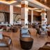 Unique Club at Lopesan Costa Bávaro Resort in Punta Cana lounge with modern seating and wood accents