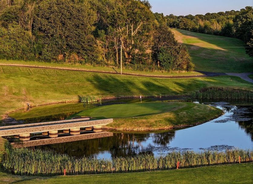 Penrhos Park, Aberystwyth golf course with a water hazard, bridge and wooded hills