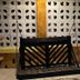 Hotel San Julio in Celestún: rustic hanging swing bench under a covered patio with decorative wall panels