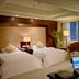 Huafang Jinling International Hotel Zhangjiagang room in Suzhou with two beds and city view