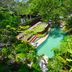Villas Sur Mer in Negril with a lush tropical pool and jacuzzi surrounded by greenery