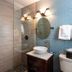 Crane's Beach House Boutique Hotel & Luxury Villas bathroom with glass shower, vessel sink and blue tile wall