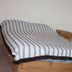 Acuarela Huasteca in Ciudad Valles: simple bed with striped cover and wooden headboard