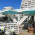 Hôtel Saint-Clair, côté Plage in La Grande-Motte with seaside terrace and turquoise umbrellas