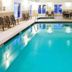 Quality Inn & Suites Bethany - Oklahoma City West indoor pool with seating area in Bethany