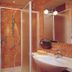 Hotel Diana in San Zeno di Montagna bathroom with shower, sink, mirror and towel rack