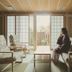 Kowakuen Haruka in Matsuyama: tatami lounge with shoji screens, sofa seating, and garden view