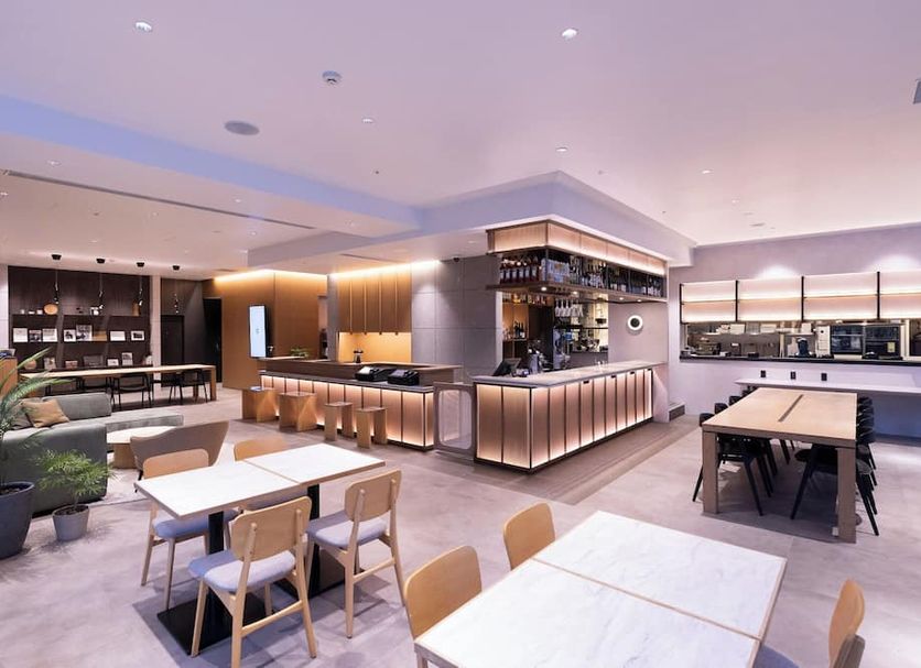 Tokyu Stay Sapporo dining area with tables, chairs, and a buffet counter