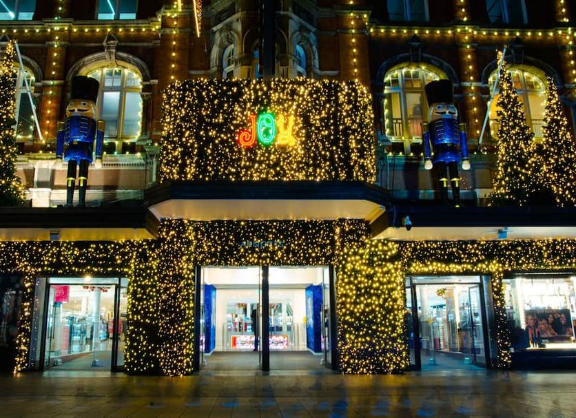 Latroupe Jacobs Inn in Dublin, illuminated at night with festive holiday lights on the facade