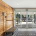 Country Inn & Suites by Radisson, Merrillville, IN lobby entrance with luggage carts and glass doors