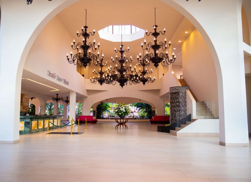 Barcelo Puerto Vallarta lobby with grand chandeliers, arched ceilings and open tropical entry