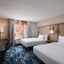 Fairfield by Marriott Inn & Suites Kansas City Airport room with two beds and a desk in Kansas City