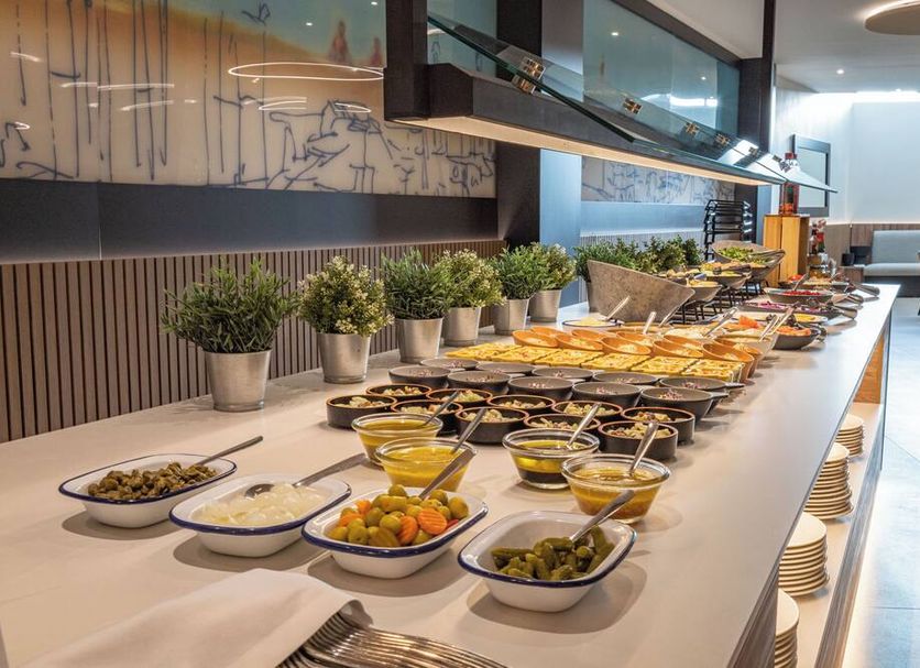 Breakfast buffet at Seth Port Ciutadella in Ciutadella de Menorca with salads, fruit, and hot dishes