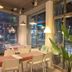 Pohang Youngildae Guesthouse seating area with large windows and street view in Pohang