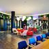 citizenM Miami World Center lobby with colorful seating and hanging greenery in Miami