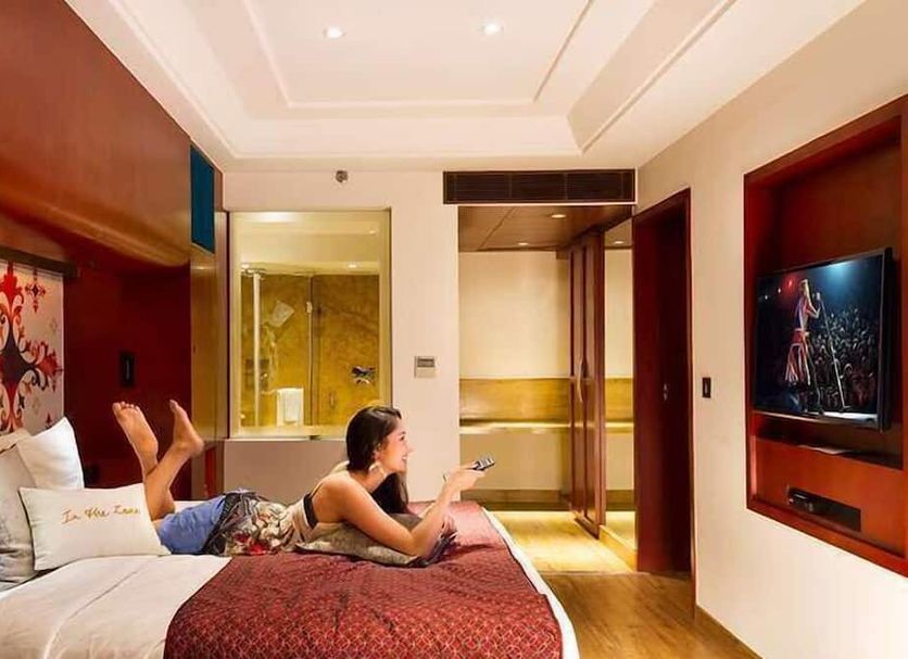 Zone By The Park Bani Park Jaipur room with TV, seating area and bathroom view