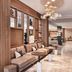 AC Hotels by Marriott San Diego Downtown Gaslamp Quarter lobby with lounge seating and wood shelving