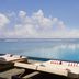 Anantara Veli Maldives Resort in Veligandu Huraa: oceanfront infinity pool with loungers and palm trees