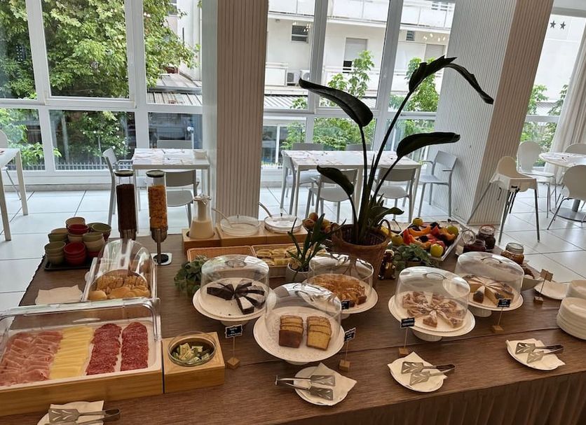Hotel Sant'Angelo in Riccione breakfast buffet with pastries, fruit, cold cuts and drinks