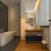 Resort Miramonti Forte dei Marmi bathroom with freestanding tub, vanity sink and mirror
