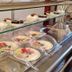 Hotel Baykal, Bogazkale breakfast buffet with pastries, fruit, and covered dishes on a glass counter