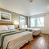 HomeTowne Studios by Red Roof Denver - Lakewood West guest room with two beds and window in Lakewood