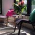 Vanilla Residence Chiangmai in Chiang Mai lounge chairs by window with flower arrangement and sunlight
