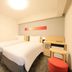 Richmond Hotel Tokyo Suidobashi room with two twin beds and a desk in Tokyo