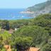 Hotel Rosa Del Tirreno in Quercianella with sea view, pine trees, and coastal hillside