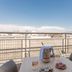 Residhotel Le Grand Prado Marseille rooftop terrace with table, chairs and city views