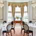 The Gleneagles Hotel in Auchterarder dining room with chandeliers, round tables and large bay window
