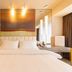 Jinjiang Metropolo Hotel Shenyang Shengjing Hospital Sanhao Street room with king bed and warm lighting