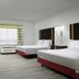 Hampton Inn & Suites El Paso-East room with two beds, desk, TV and window air conditioner in El Paso