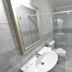 Hotel Cabanas Alto Da Serra bathroom in Canela with sink, toilet, mirror and glass shower
